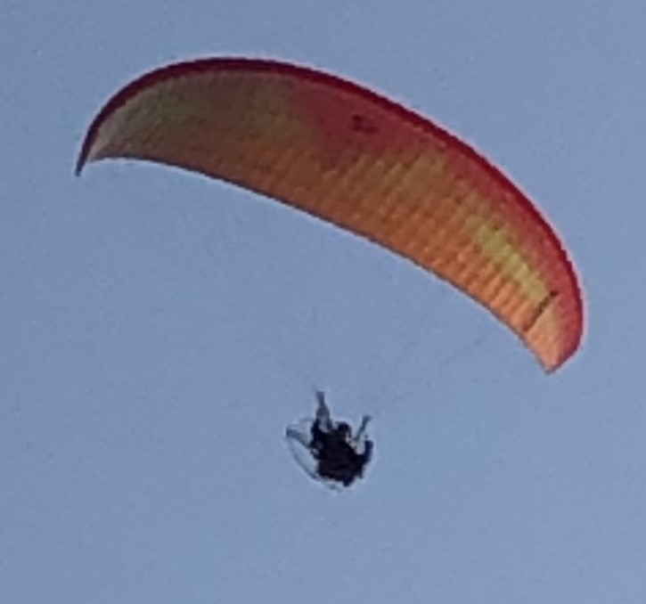 A paraglider over The Farm